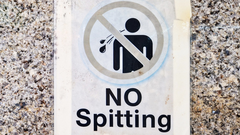 modern day sign for no spitting reminder
