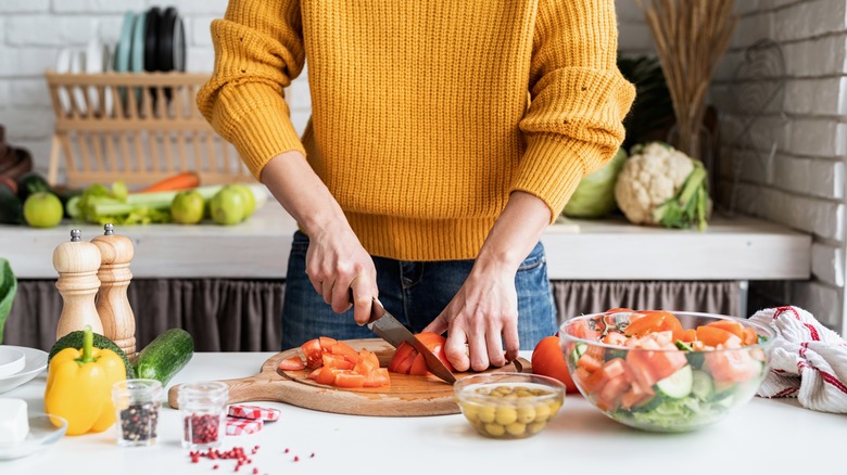 a person making a salad 