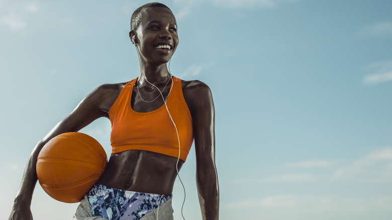 woman holding a basketball