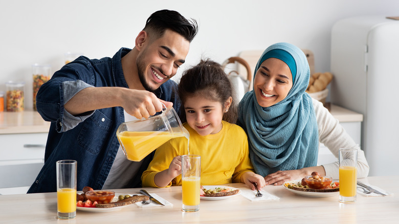 happy family eating a healthy breakfast