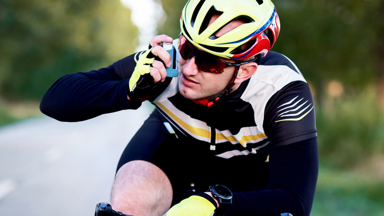 cyclist with inhaler outdoors