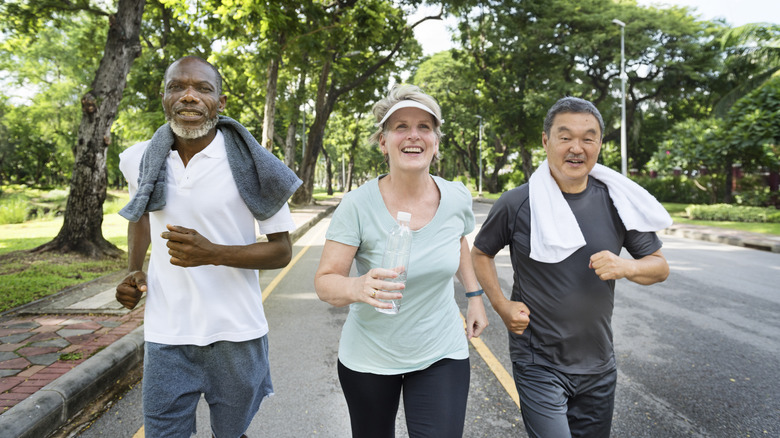 group of mature men and women running