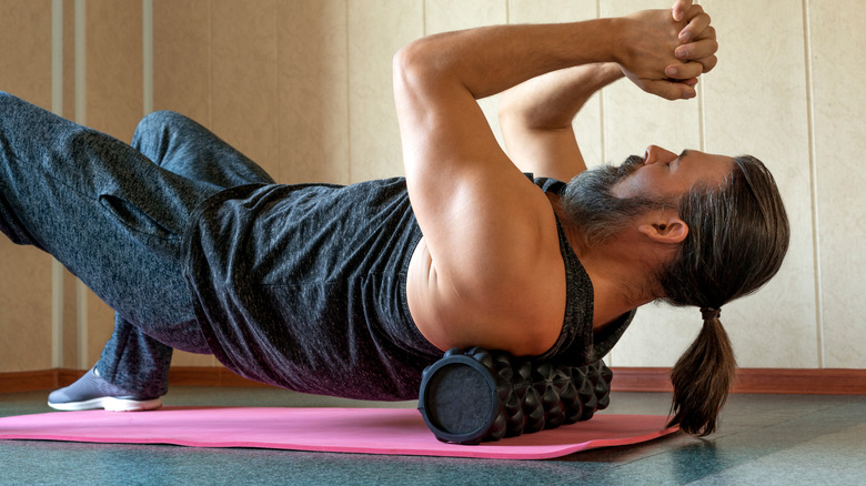 man doing thoracic back exercises