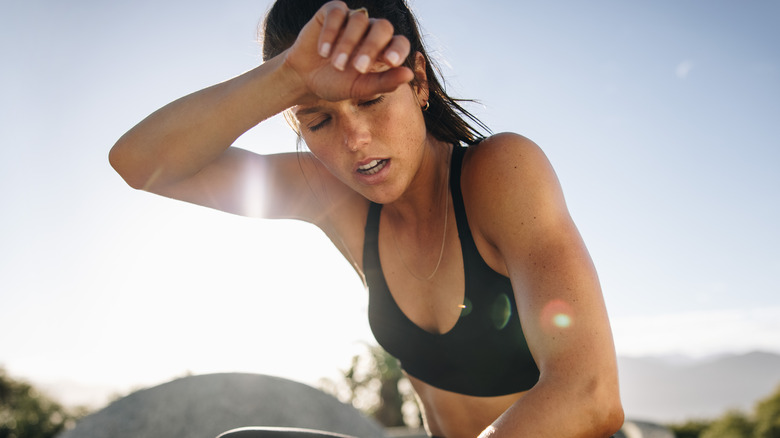 tired woman exercising outdoors