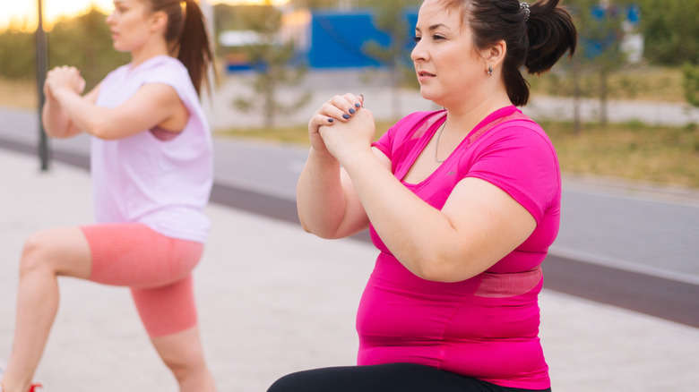 woman standing on one leg