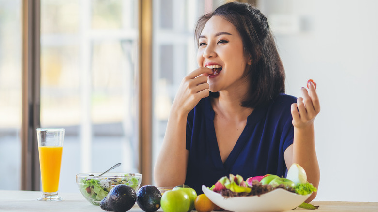 Woman eating vegetables