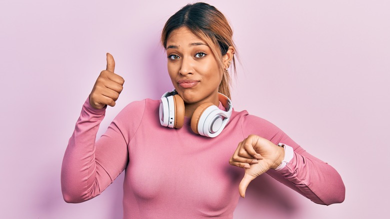 Woman with headphones around her neck