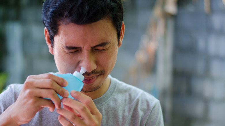 Man using neti pot