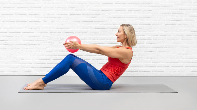 woman doing half roll back