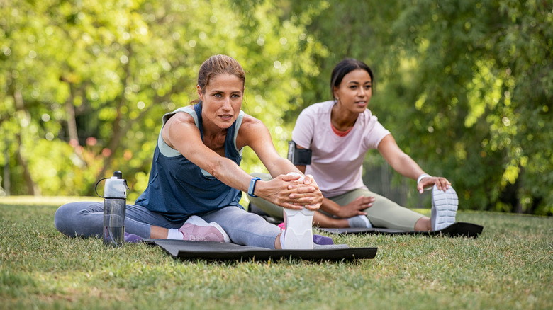 Woman stretching on the grass