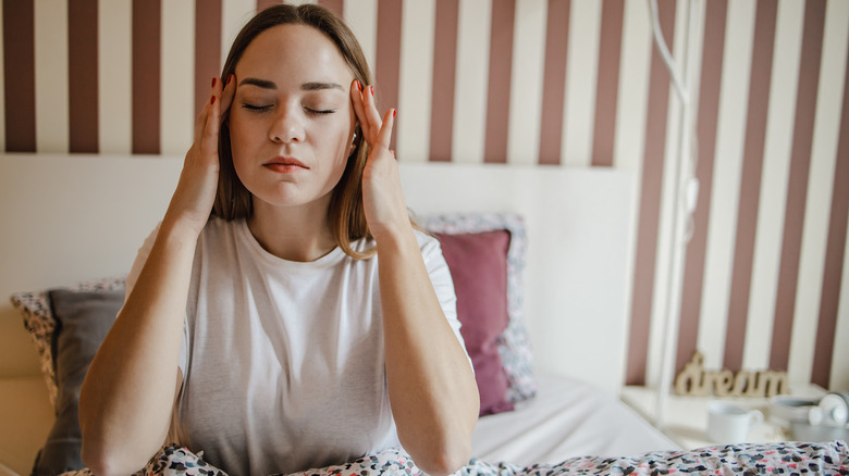 Woman experiencing dreaded hangover 