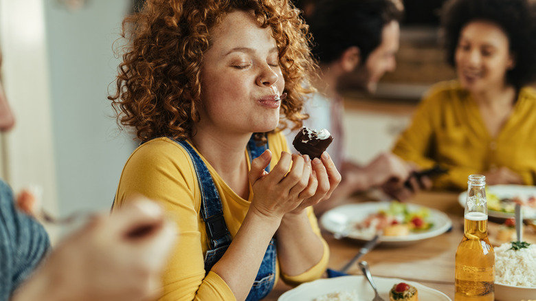 woman enjoying indulgent dessert