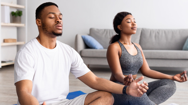 seated couple meditating