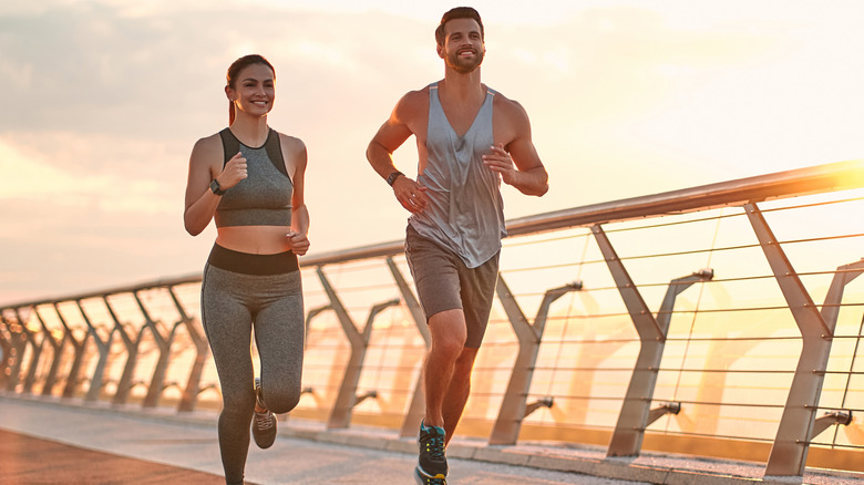man and woman running