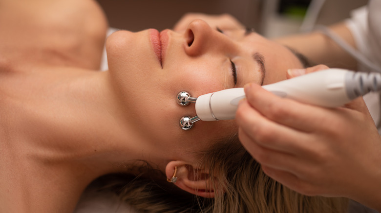 close up of a woman receiving dermabrasion on her face 