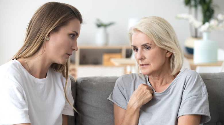 Calm woman talking to nervous woman