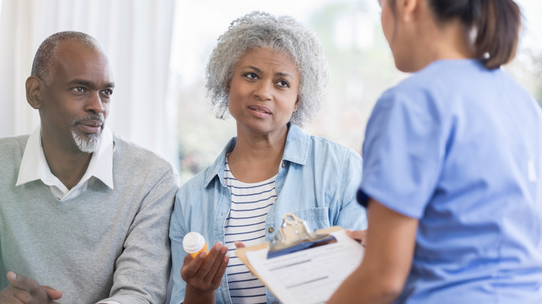 Woman asking healthcare provider about medication