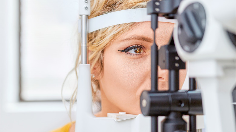 Woman getting her eyes checked at the eye doctor