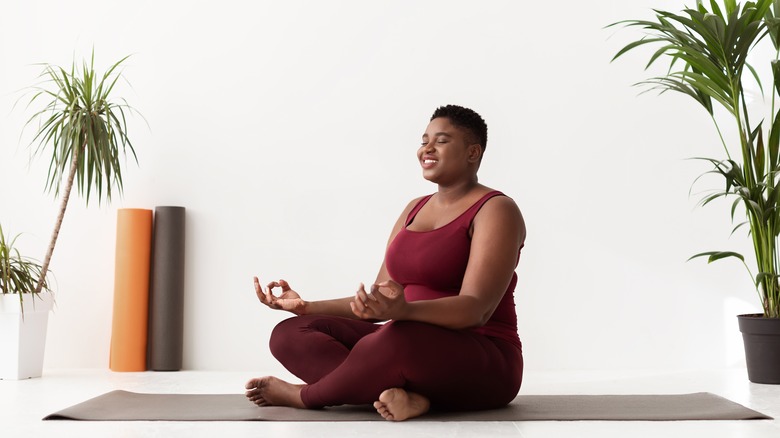 a woman practicing yoga