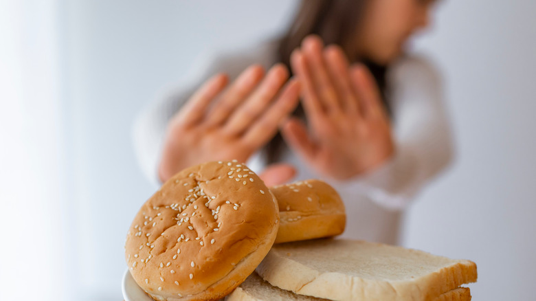 Woman rejecting bread 