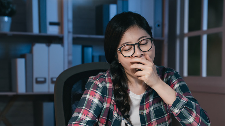 woman staying up late at desk