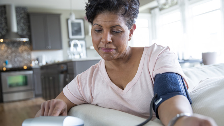 woman taking her blood pressure