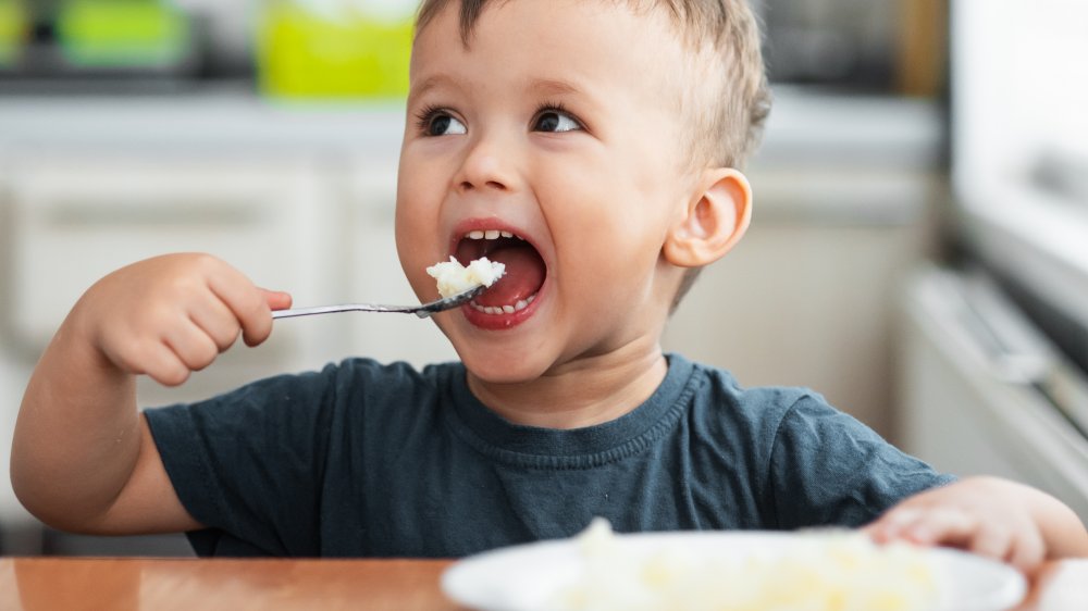 Child eating rice