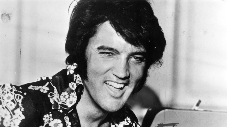 Elvis Presley smiling and laughing