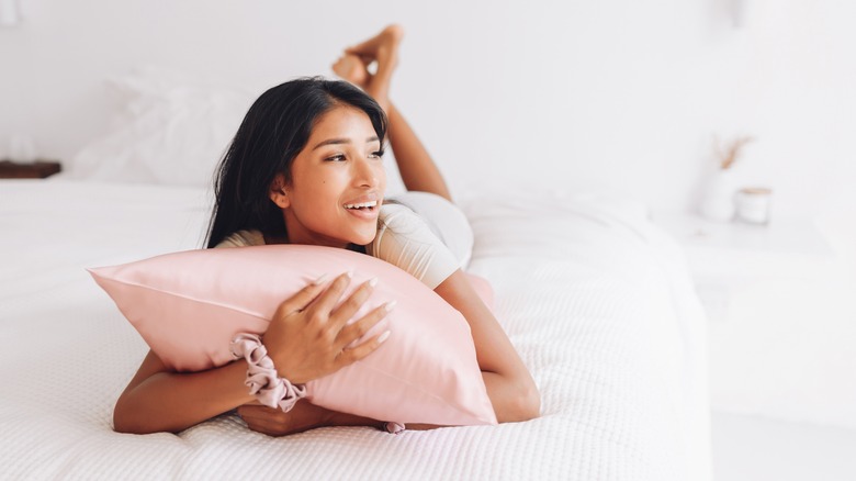 Woman with silk pillowcase