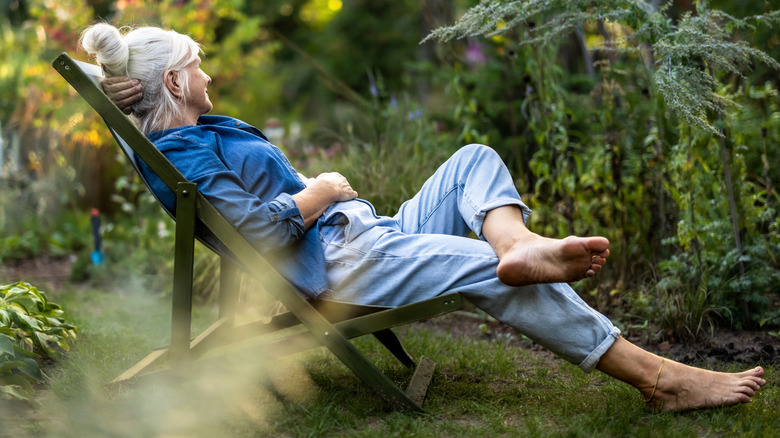 woman relaxing in a garden atmosphere
