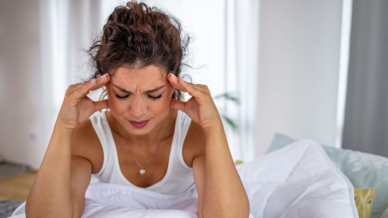 Woman holding her head