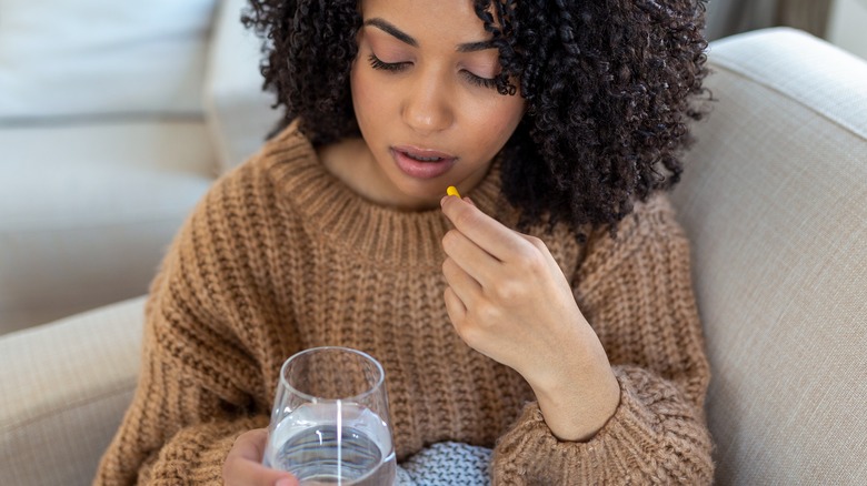 Woman taking medication