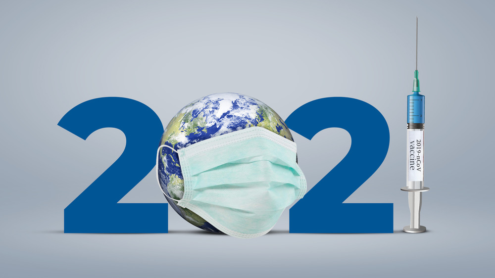 The numbers 2021 with a globe for the zero and a syringe for the one