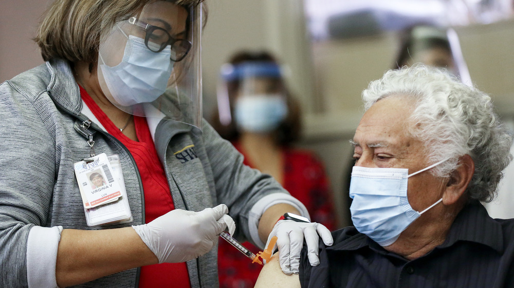 A California man in a long-term care facility receives the COVID-19 vaccine