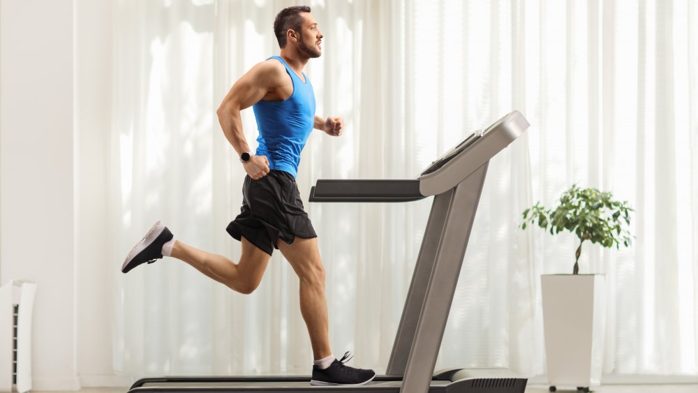 man running on treadmill