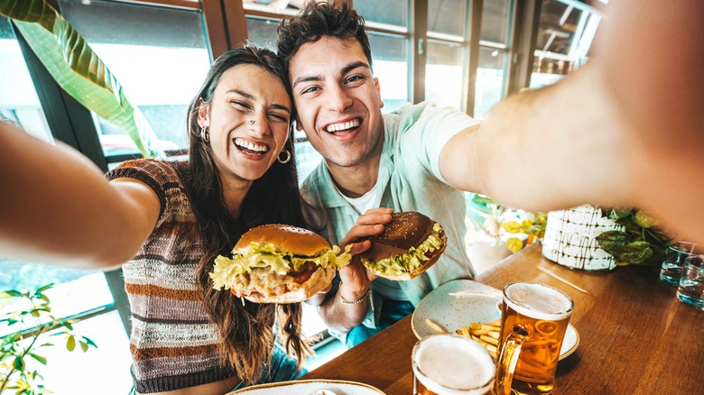 Couple over the weekend enjoying beer and burgers