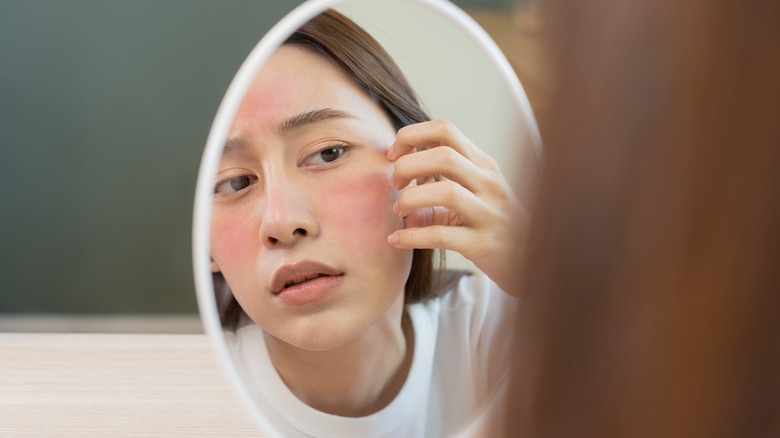 woman looking in the mirror