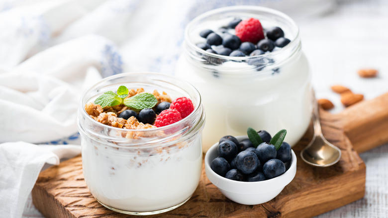 Three jars with Greek yogurt inside