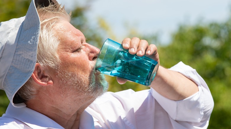 man drinking water