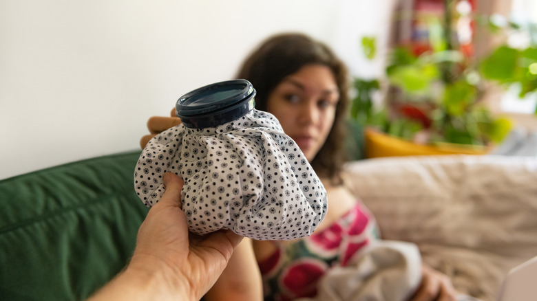 Woman taking an ice pack