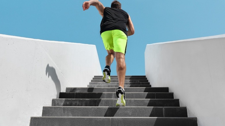 man running up stairs 