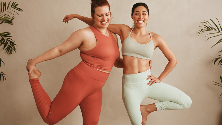 Two women in exercise clothes smiling