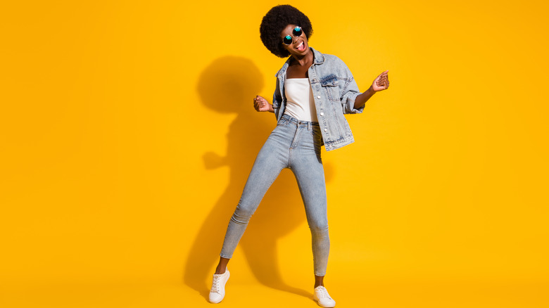 woman dancing with yellow background 