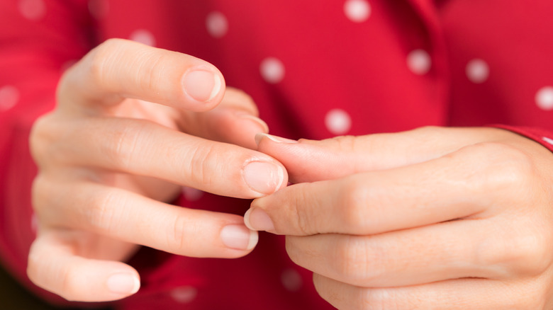 Woman holding her finger