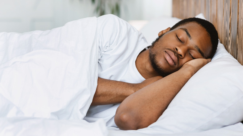 Man sleeping in bed at home﻿