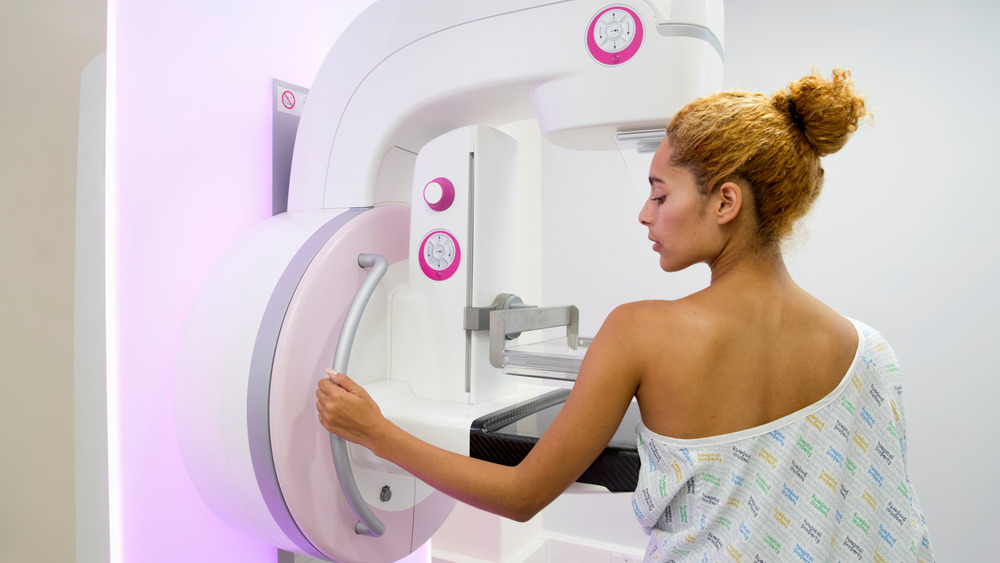 Female patient undergoing mammogram procedure