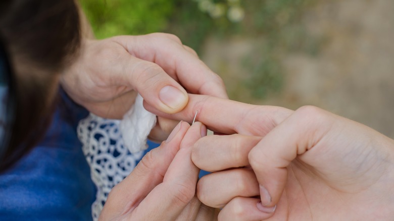 Removing a splinter from finger