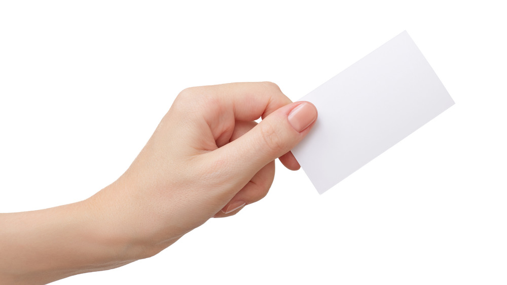 hand holding a blank card