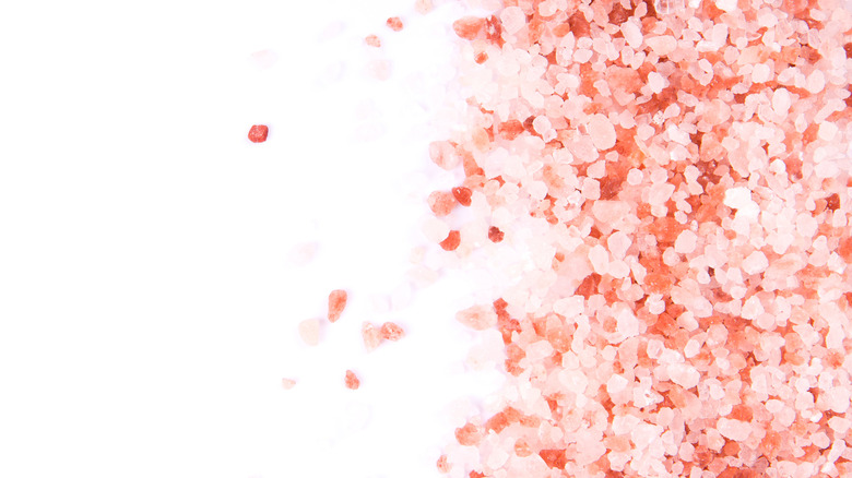 Pink Himalayan salt on white background