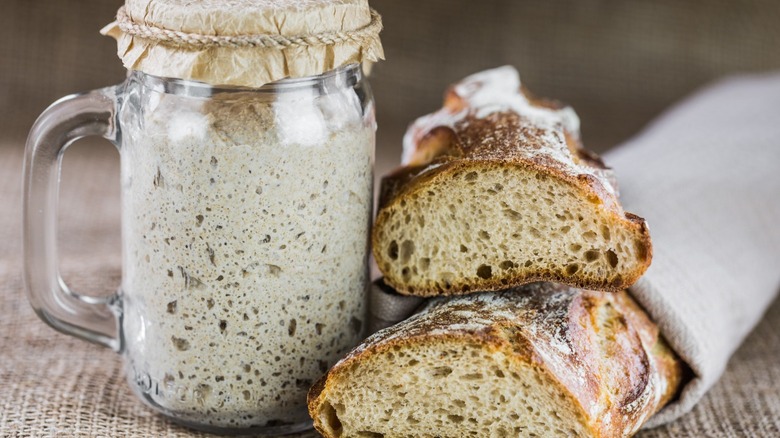 Sourdough starter and bread loaf